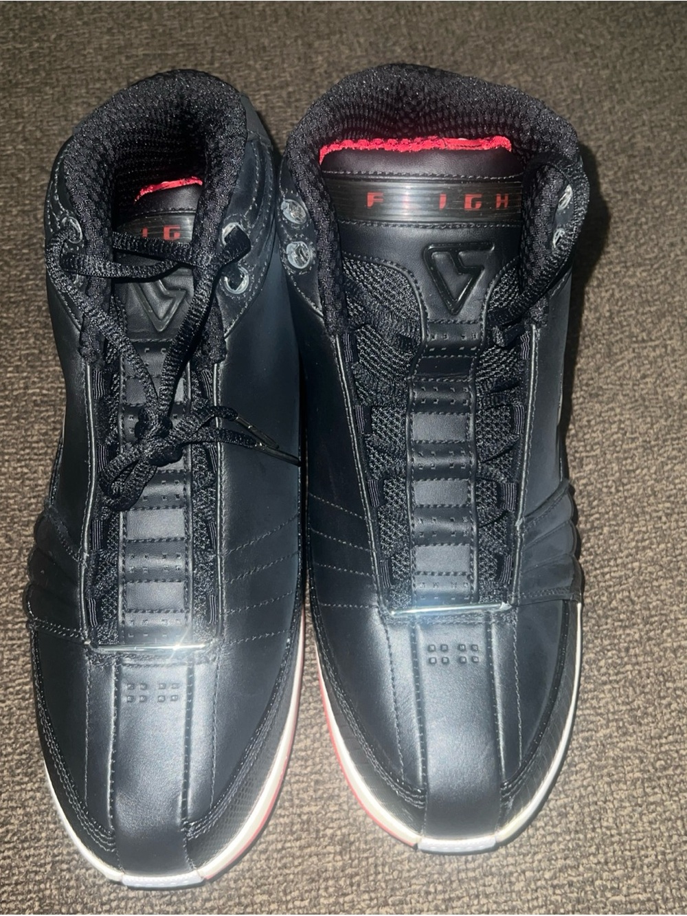 Nike Men’s Black Athletic Sneakers with Red Accent